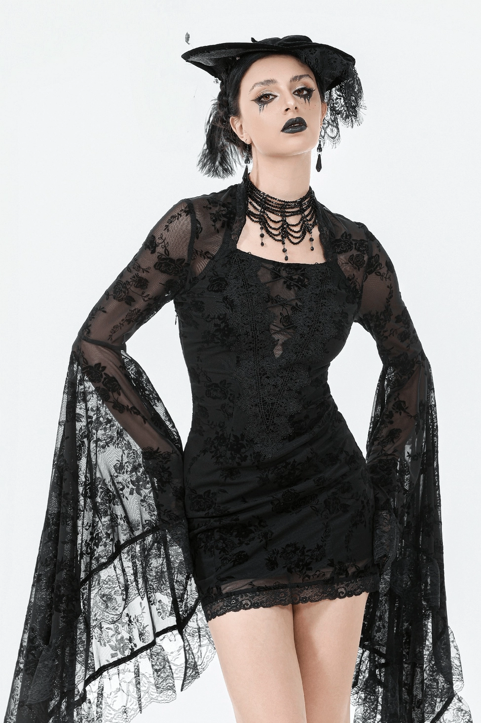 Black gothic lace mini dress showing square neckline and upper torso lace detail