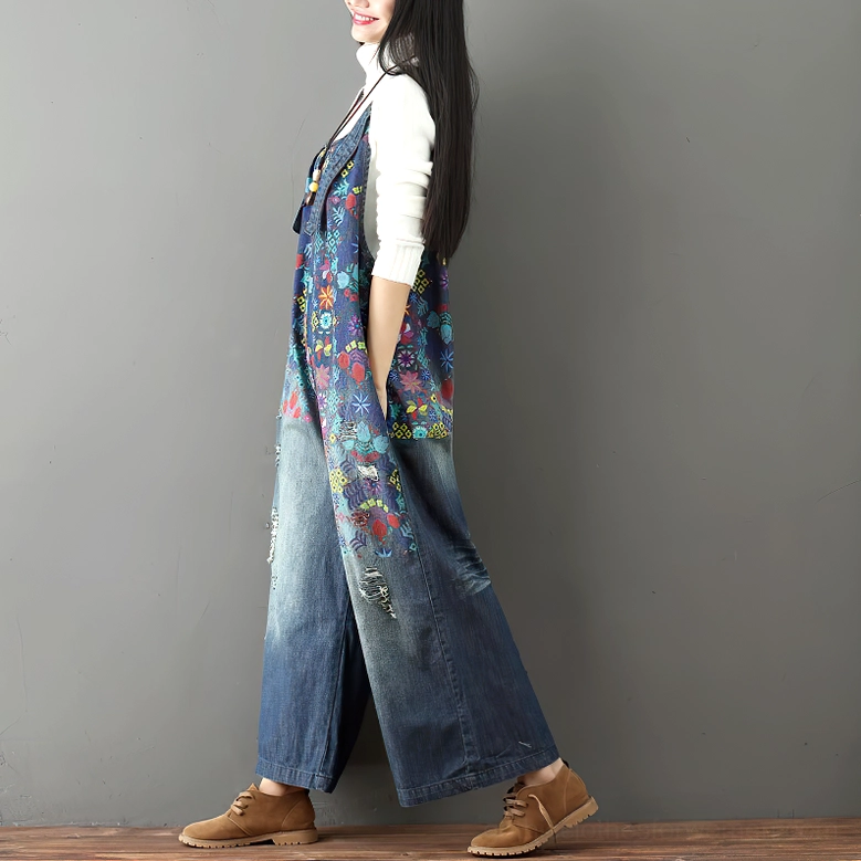 Floral denim overalls left side full view on female model paired with brown leather casual footwear for complete gothic styling