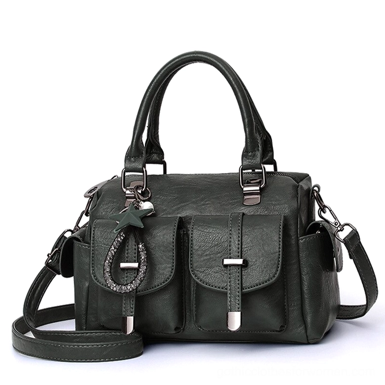 Forest green leather boston bag with detachable star pendant, dual exterior pockets, and polyester lining