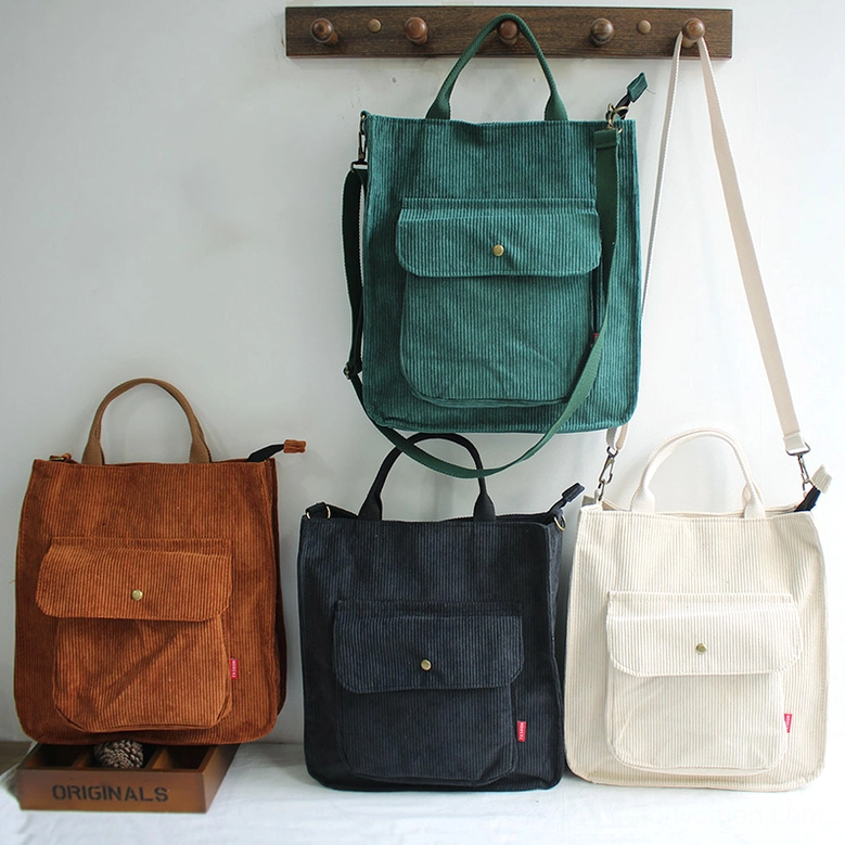 Four-color corduroy gothic tote bag collection in black, beige, camel, and dark green, tabletop arrangement showcasing complete color palette