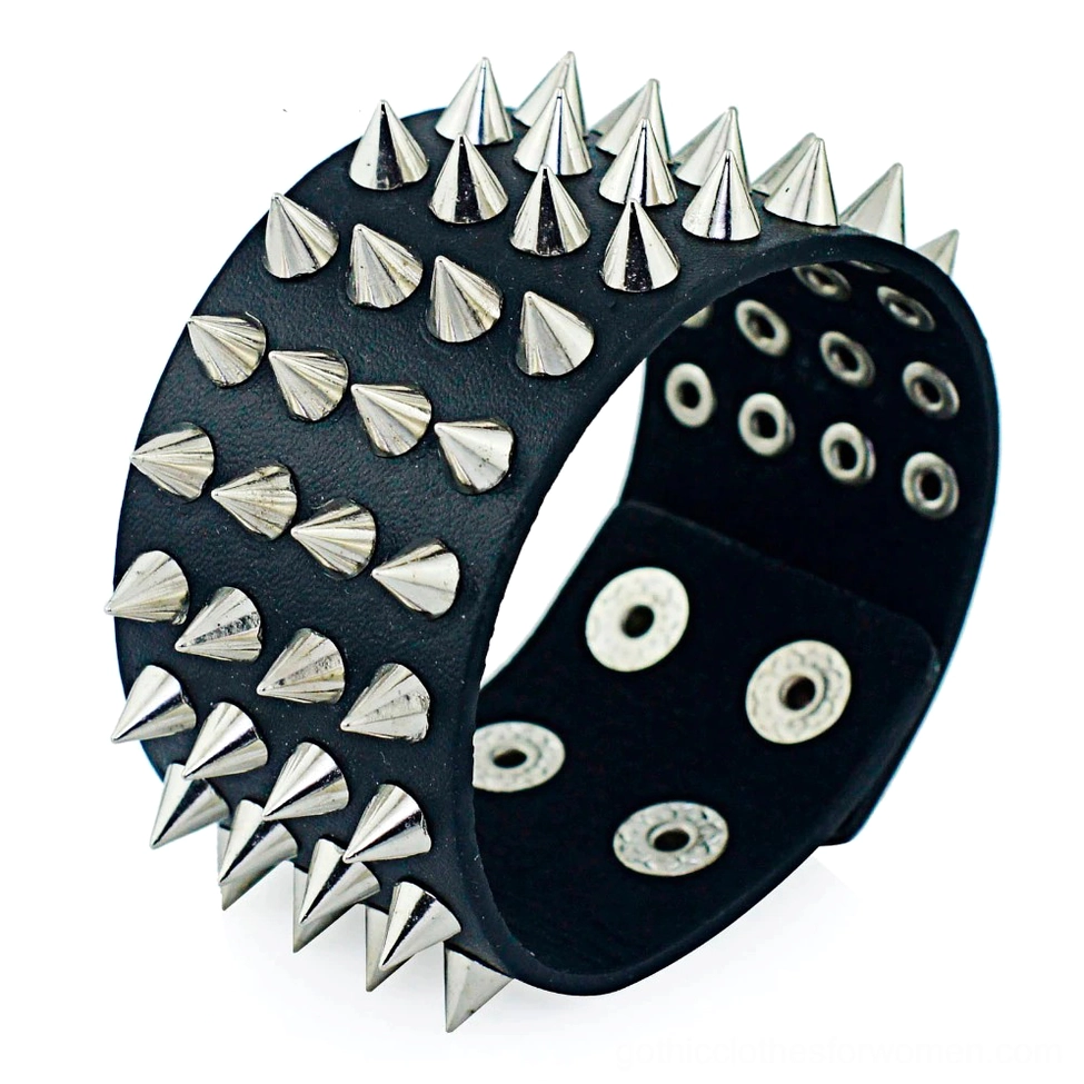 Four-row spike gothic leather bracelet oblique view showing geometric cone spike alignment on black PU leather cuff