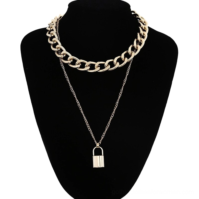 Gold padlock pendant necklace with dual chain construction featuring thick curb chain and delicate accent chain on black mannequin, gothic alternative jewelry style