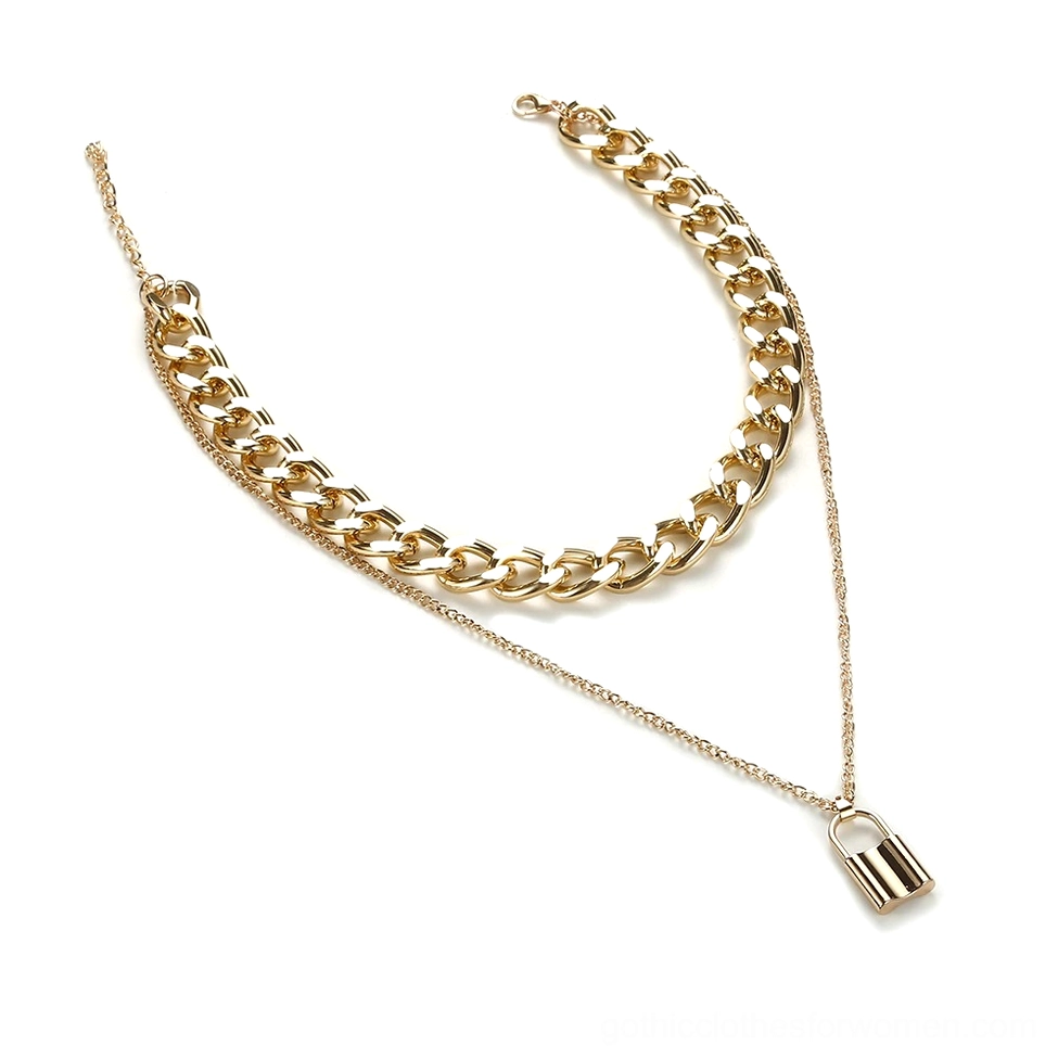 Gold padlock pendant necklace flat lay top-down view showing polished metal finish and chain detail on white background, gothic chain jewelry