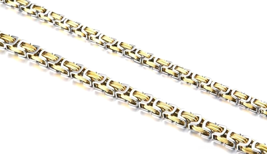Flat lay flat view of gold and silver twisted chain biker necklace - gothic fashion jewelry styling