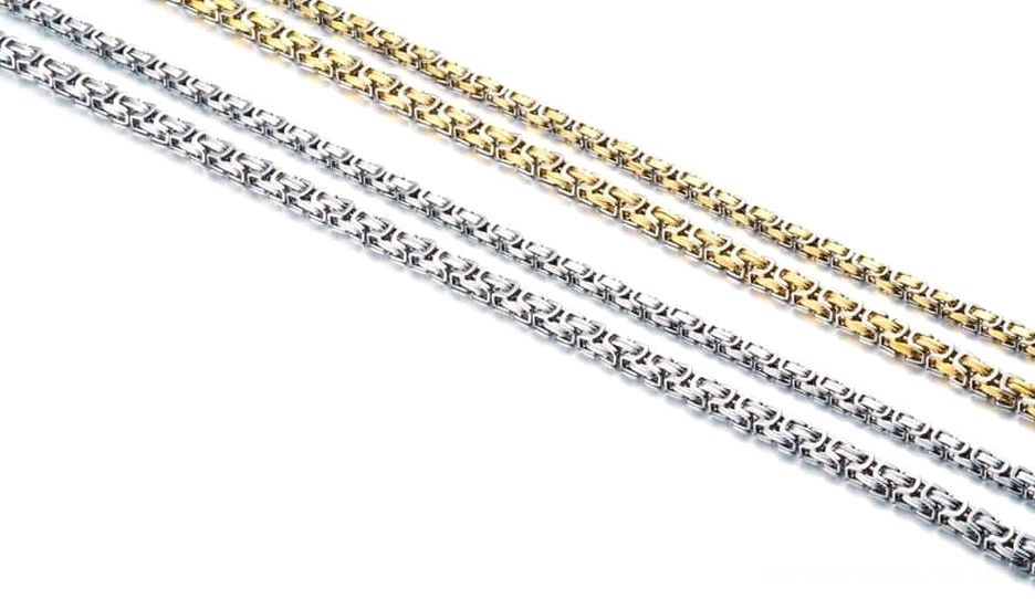Silver and gold two-tone twisted chain necklace flat display - gothic biker jewelry styling