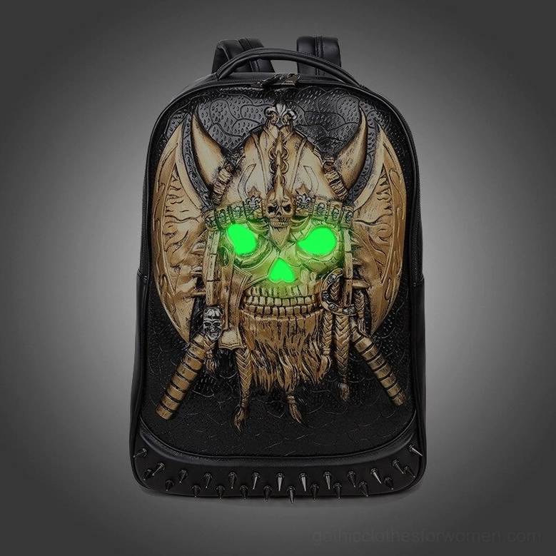 Gold viking skull backpack with glowing green eyes creating dramatic gothic mystical effect