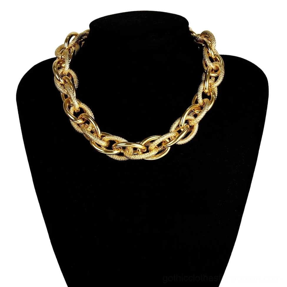 Gold-toned twisted curb chain necklace on black mannequin display, chunky statement jewelry piece