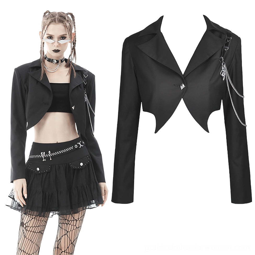 Black cropped goth jacket with chain embellishments paired with fishnet stockings, full body alternative fashion look