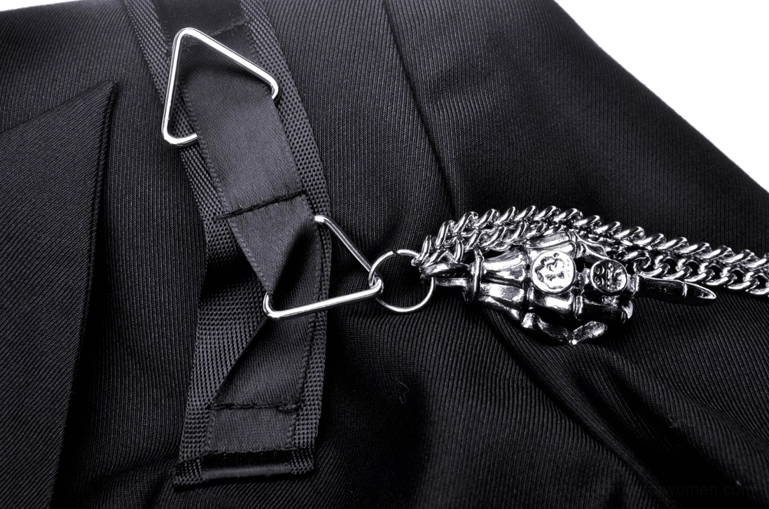 Close-up detail of metal buckle webbing strap with silver chain on cropped goth jacket