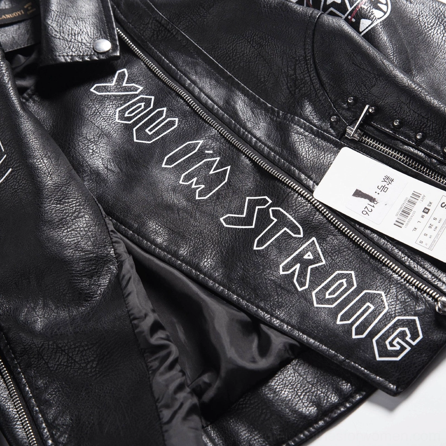 Side view black leather motorcycle jacket showing sleeve fit shoulder construction and profile silhouette details