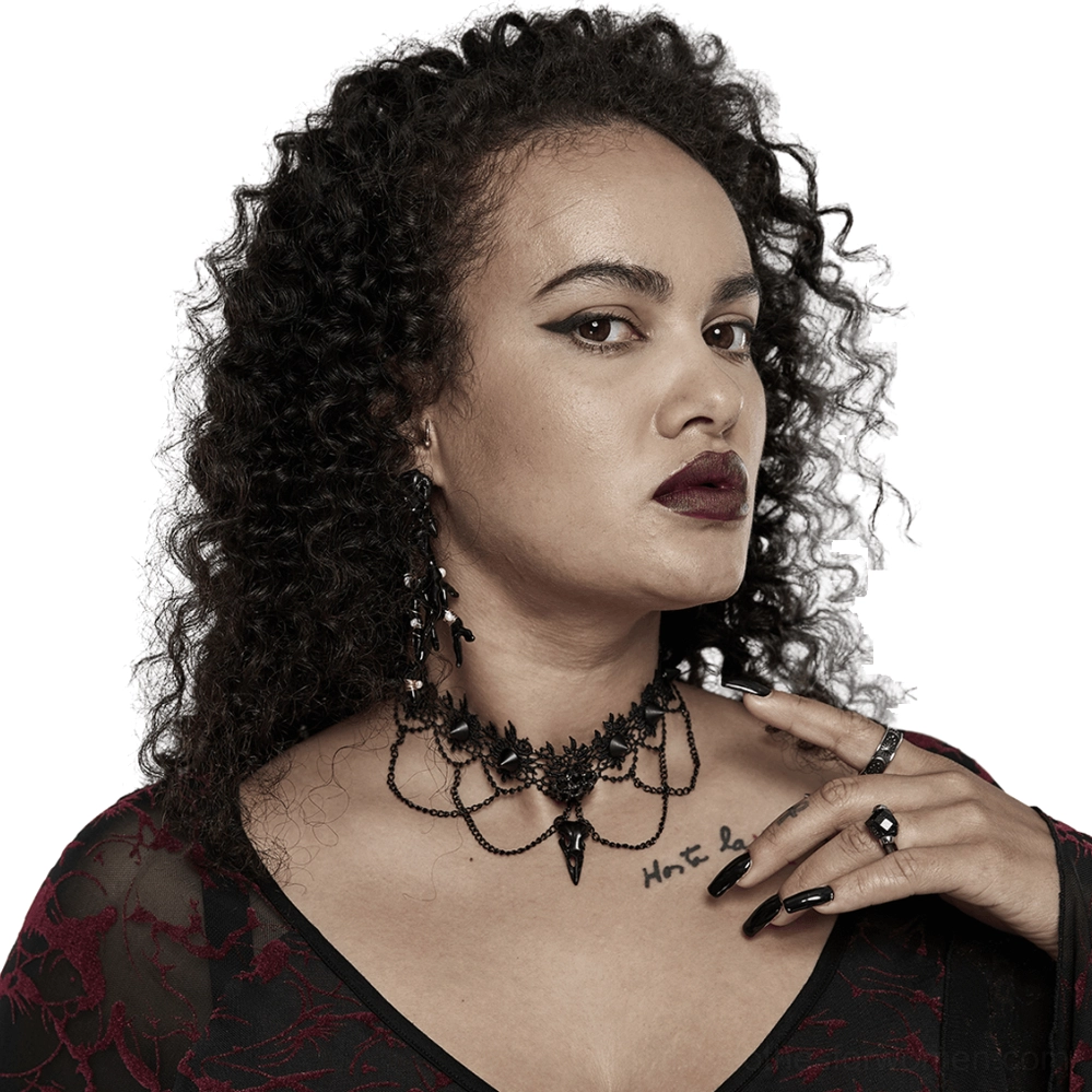 Black lace bird skull choker necklace worn by goth model with dark makeup, front close-up view