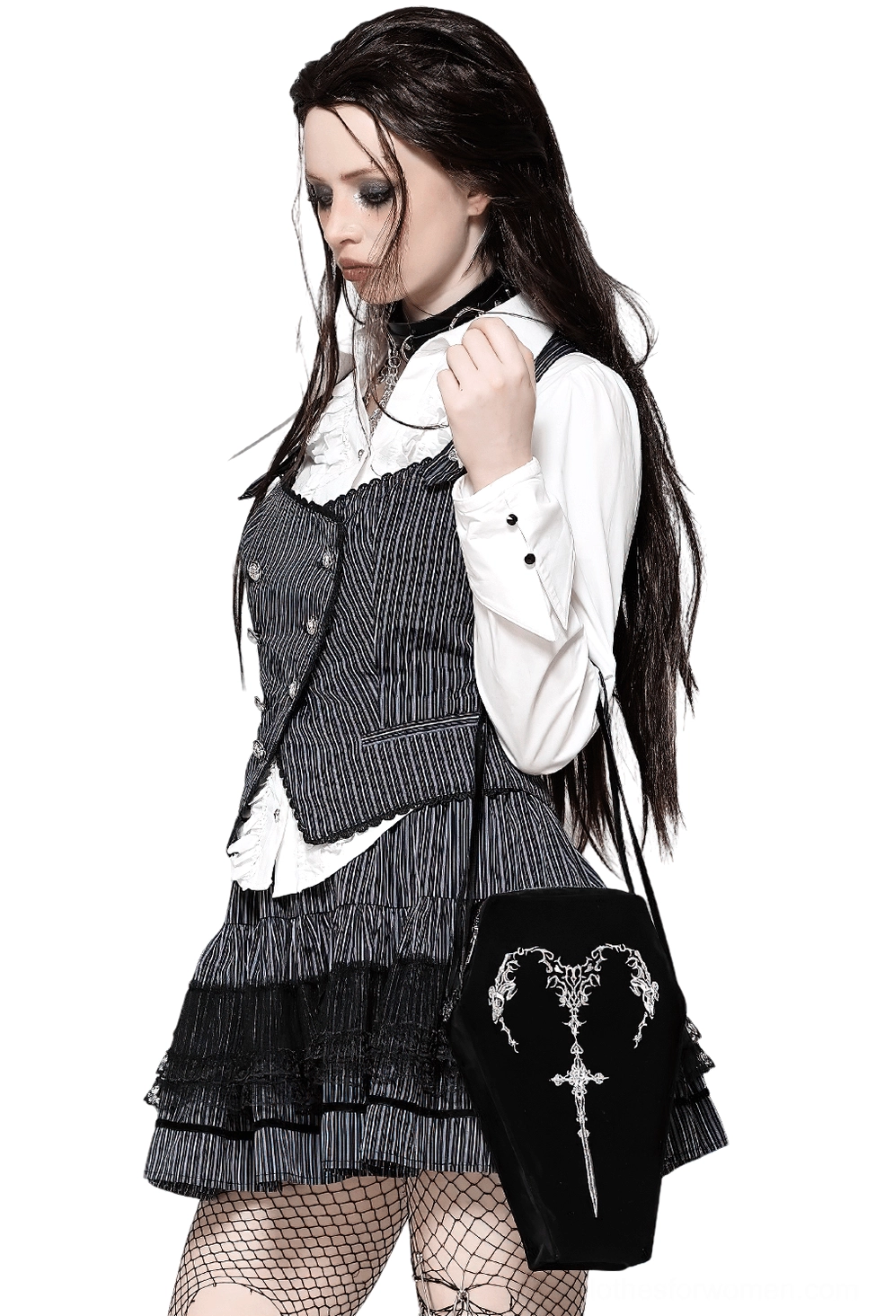 Gothic model wearing black coffin shoulder bag with embroidered sword design on shoulder three-quarter view