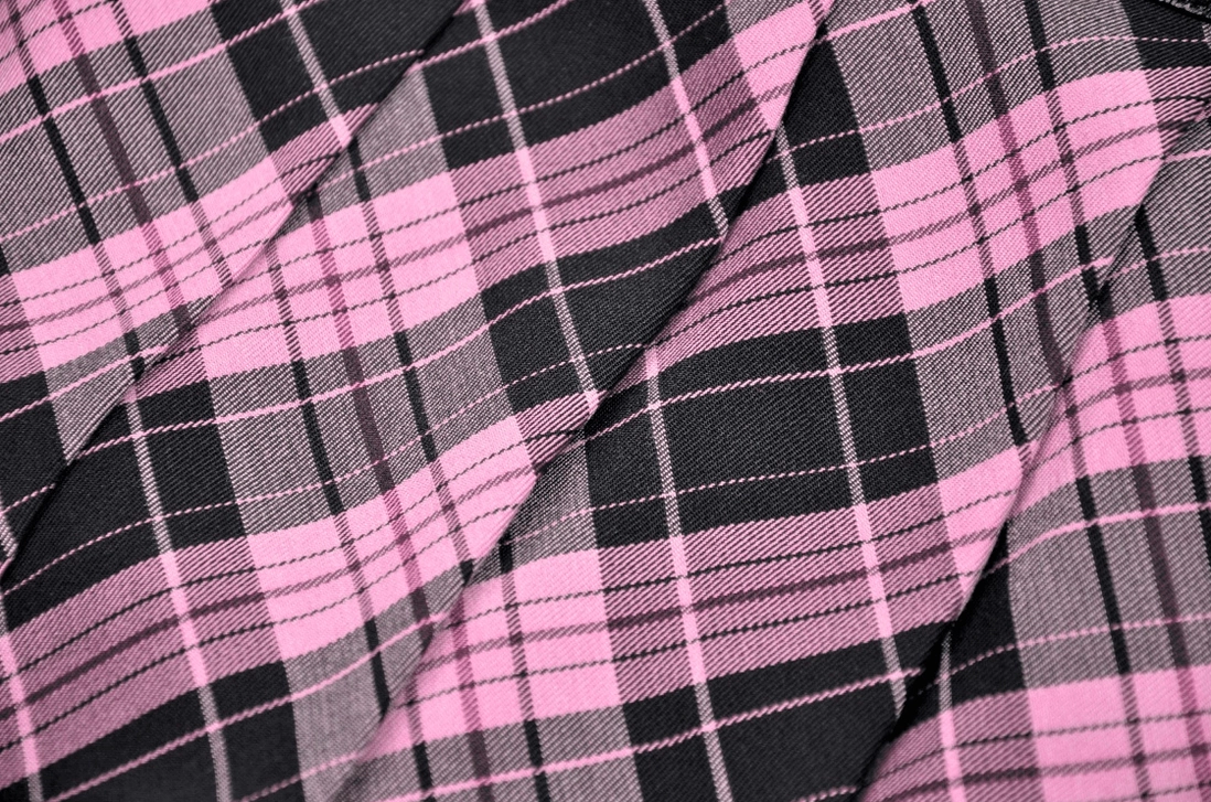 Black-pink plaid gothic mini skirt paired with band tee and combat boots goth rock outfit