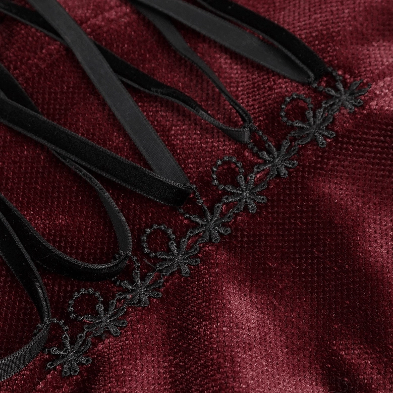 Alternative fashion gothic velvet blouse showcasing lace puff sleeves and ornate detailing - styling view