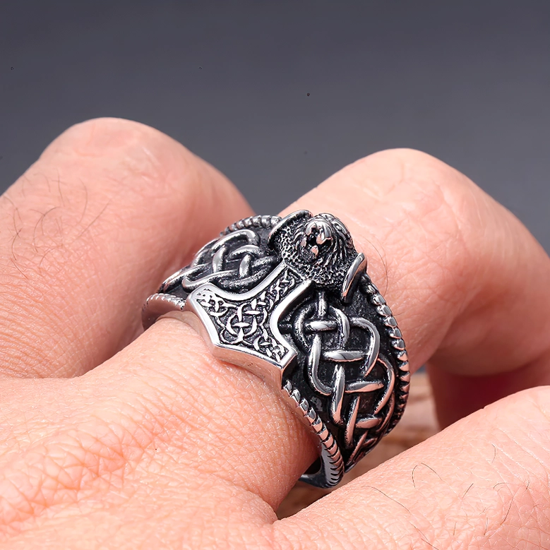 Unisex Viking amulet ring worn on finger eagle Mjolnir Celtic knot texture