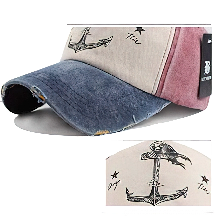 Close-up detail view of ship anchor and star print on navy beige and red gothic baseball cap, top-down perspective