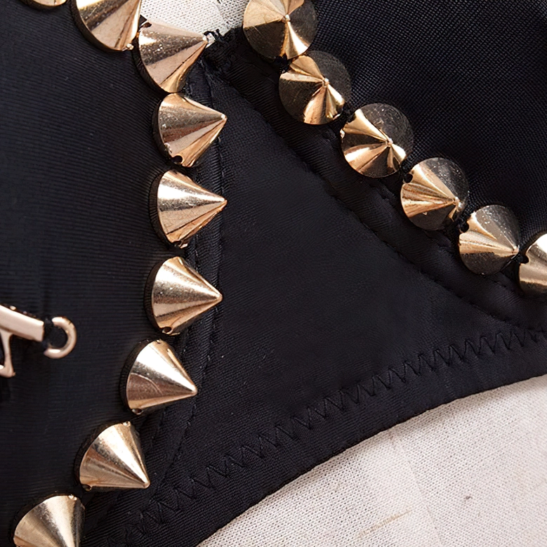 Black gothic bustier with spiked angel wings and metallic cone rivets perfect for alternative fashion styling