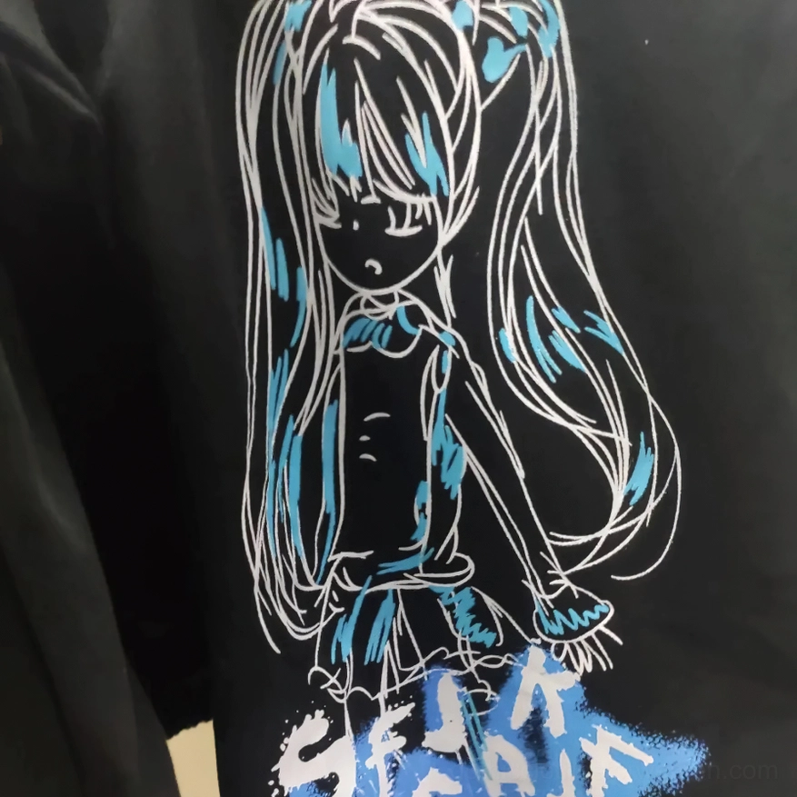 Detailed close-up of anime character graphic with long hair and blue accents on black gothic jogger pants