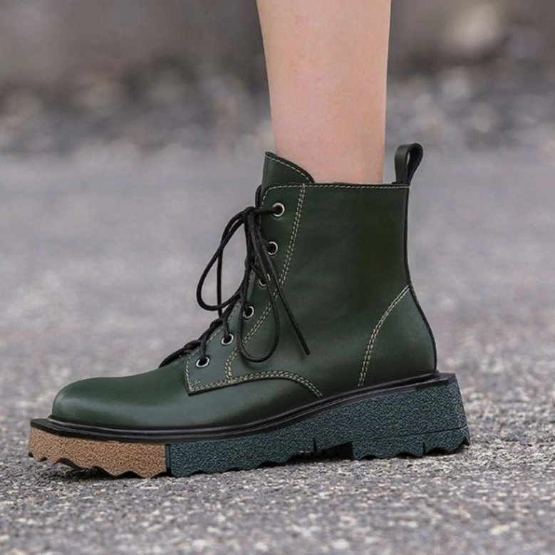 Gothic lace-up platform ankle boots genuine leather construction, dual-closure system detail, contemporary alternative footwear