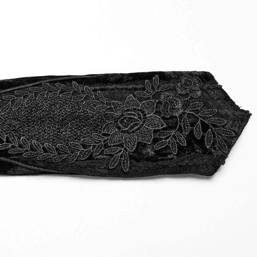 Detailed close-up of three-dimensional floral rose lace embroidery on black velvet arm glove