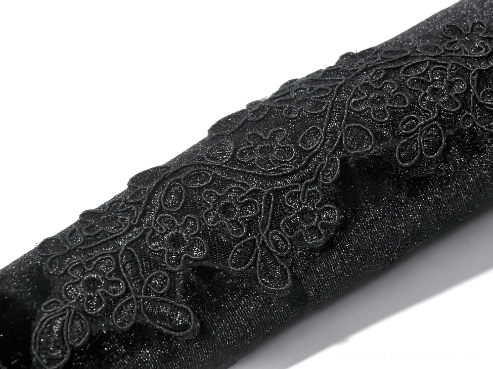Detail photography of black lace gothic arm warmer elastic cuff and floral embroidery pattern close-up