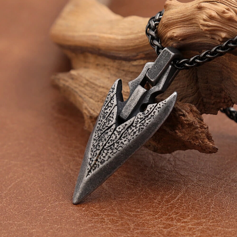 Arrowhead pendant side profile view - gothic geometric design low angle shot