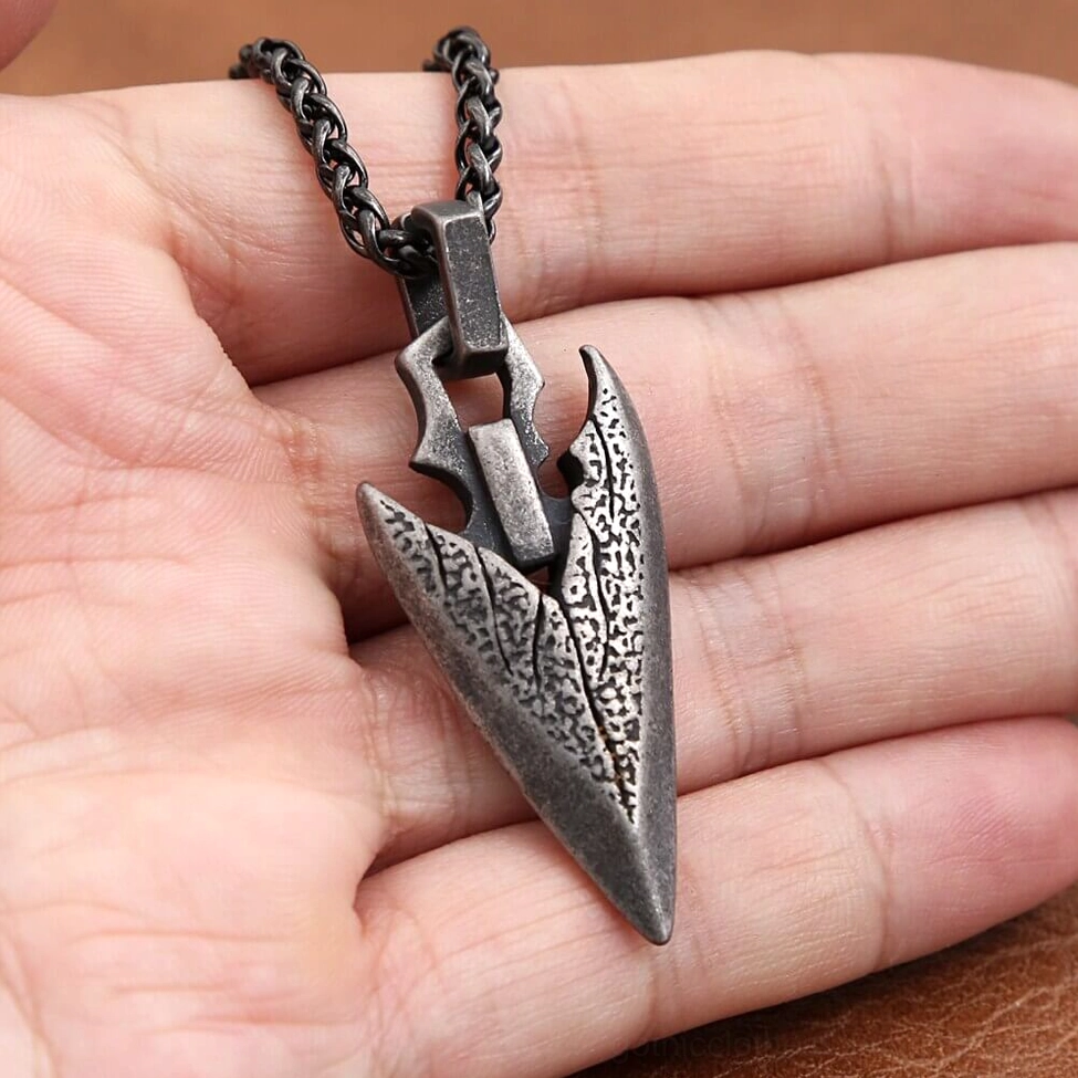 Arrowhead pendant necklace worn on skin close-up - scale and weight reference shot