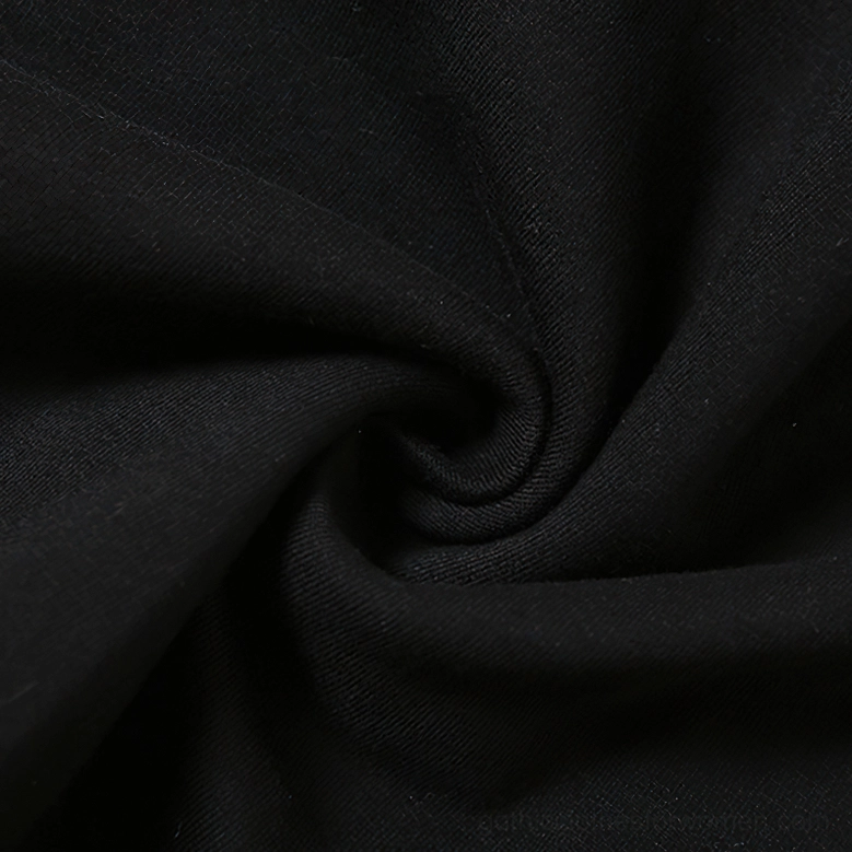 Alternative angle of gothic one-shoulder patchwork crop top showcasing pentagram focal point and asymmetric neckline construction