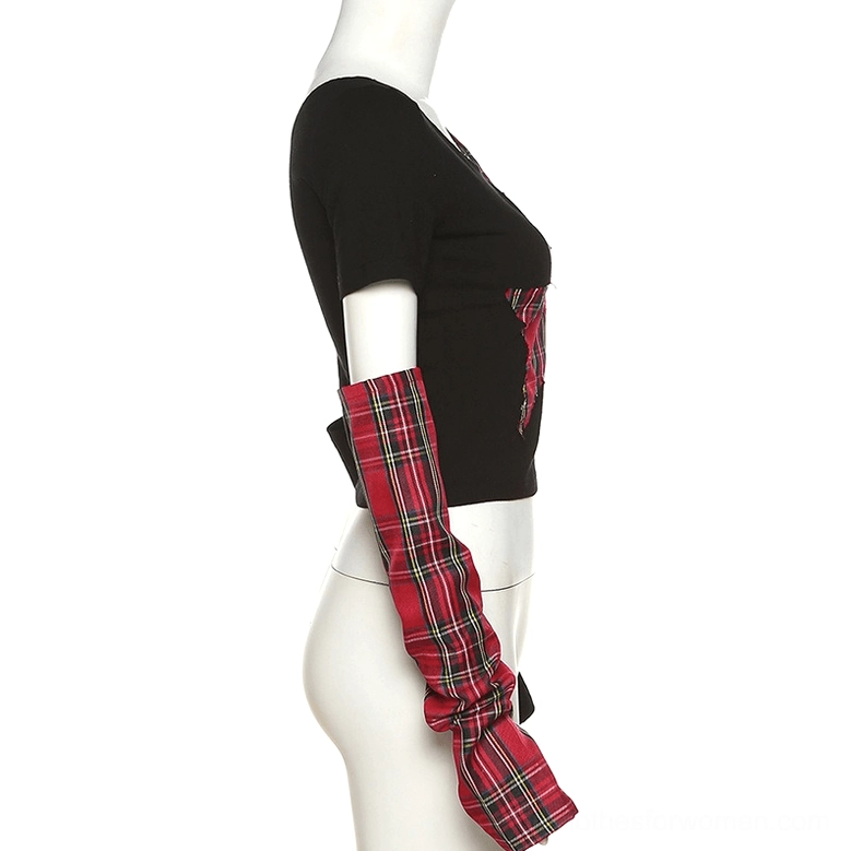 Side view of asymmetric gothic patchwork crop top on dress form mannequin, showing short single sleeve and structured one-shoulder silhouette