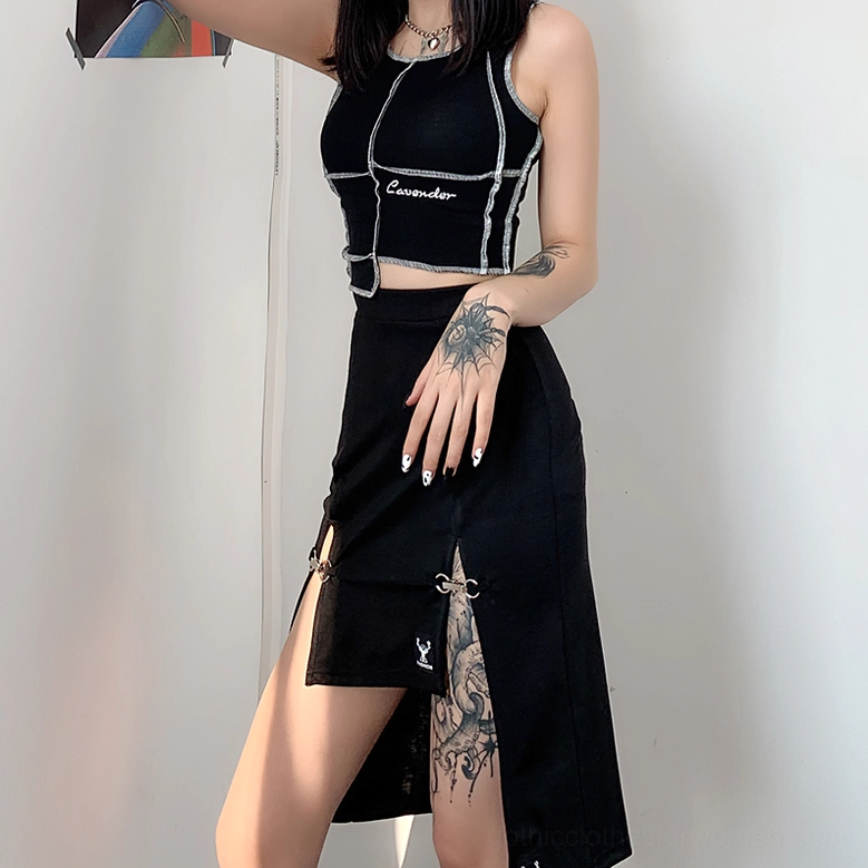 Low angle side view of black gothic asymmetric skirt showing metal ring splits and brand hem patch
