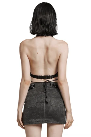 Backless halter crop top rear view displaying open back design, adjustable waist buckle strap, and pointed hem silhouette