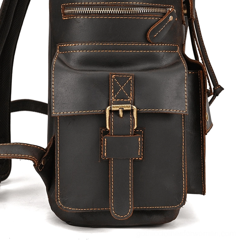 Gothic leather laptop backpack alongside lifestyle fashion items