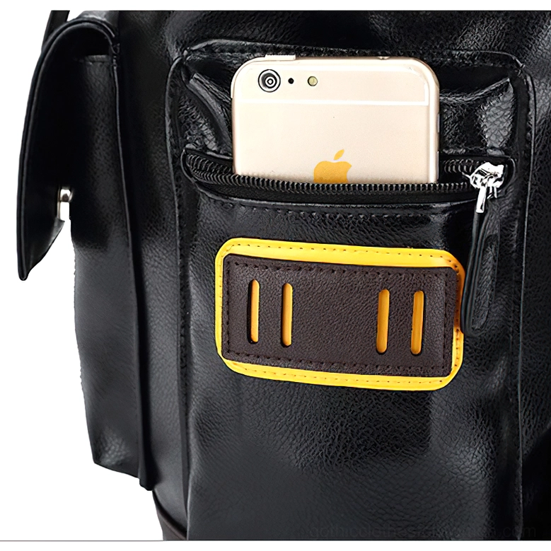Black gothic backpack front pocket close-up with smartphone-sized zipper pocket and yellow patch accent