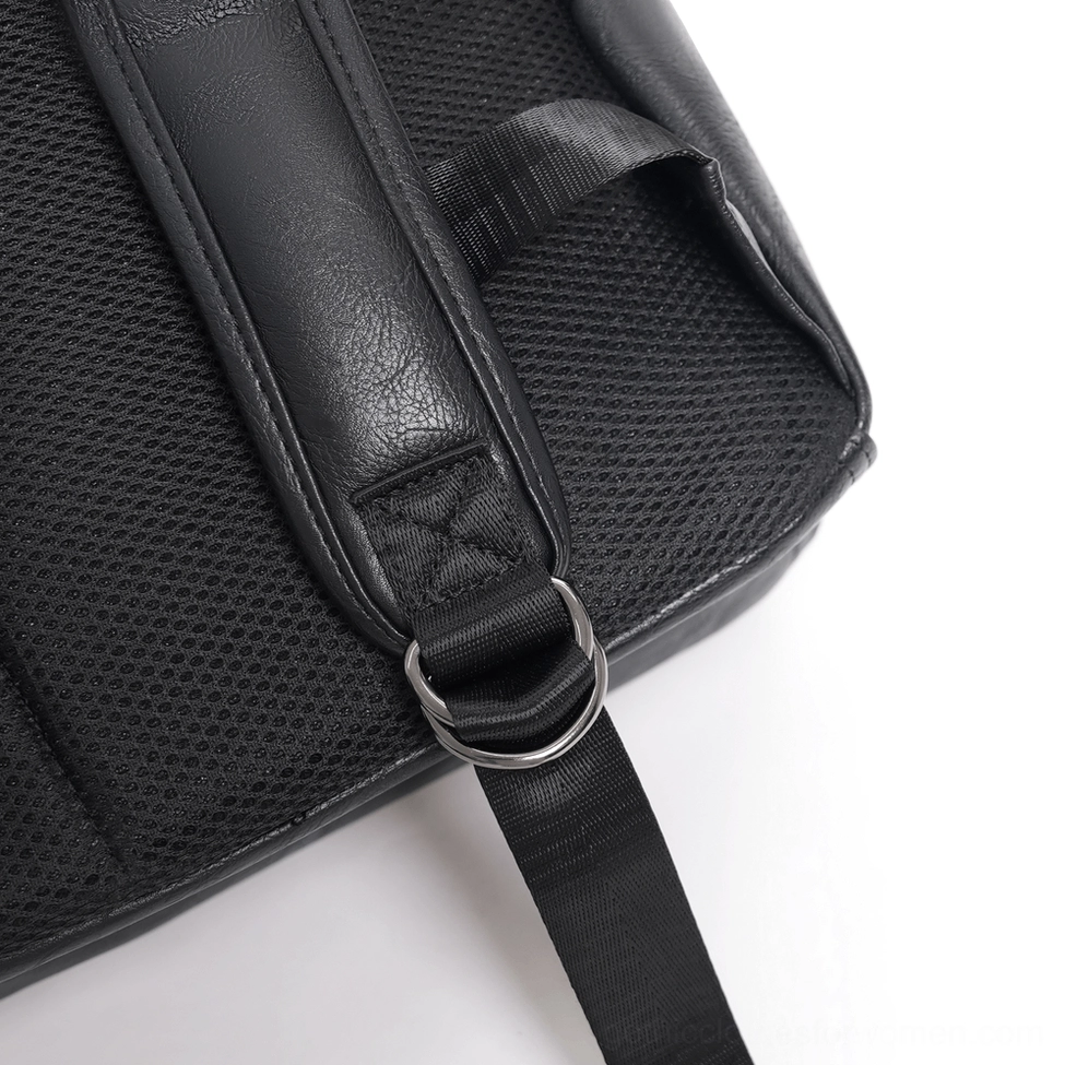 Back close-up detail of gothic backpack strap area featuring leather shoulder strap, metal D-ring and mesh padding