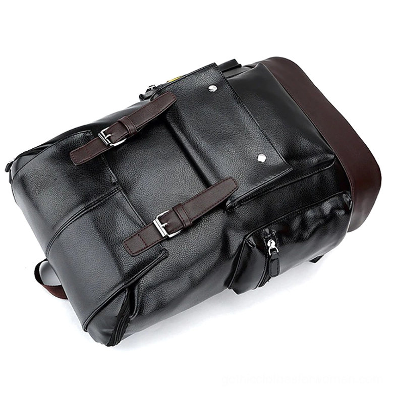 Black gothic leather backpack top oblique view highlighting dual front buckles and side zipper pockets