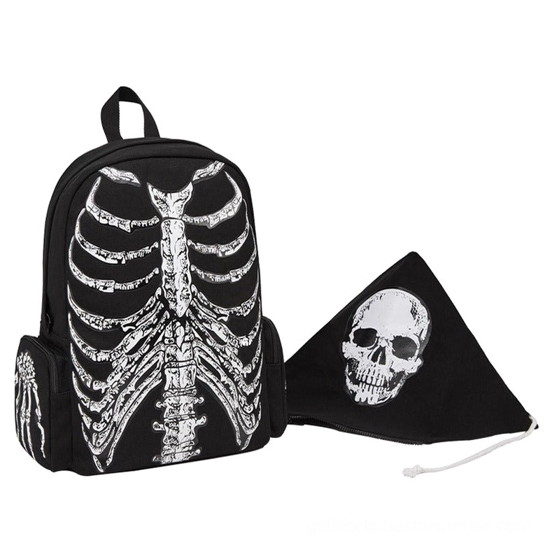 Skeleton ribcage backpack paired with gothic skull bandana styling flat lay