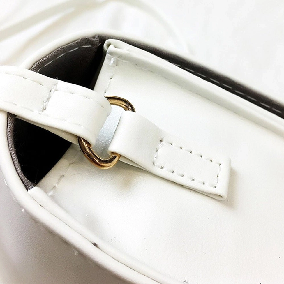 Gothic crossbody bag displaying adjustable strap configuration and ergonomic shoulder carry design
