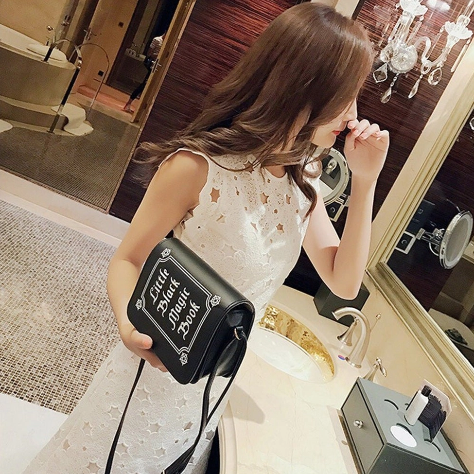 Gothic crossbody bag with letter printing pattern showing texture and printing quality of PU leather material