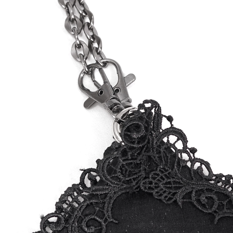 Close-up detail of metal chain hardware and lace attachment on gothic bucket bag