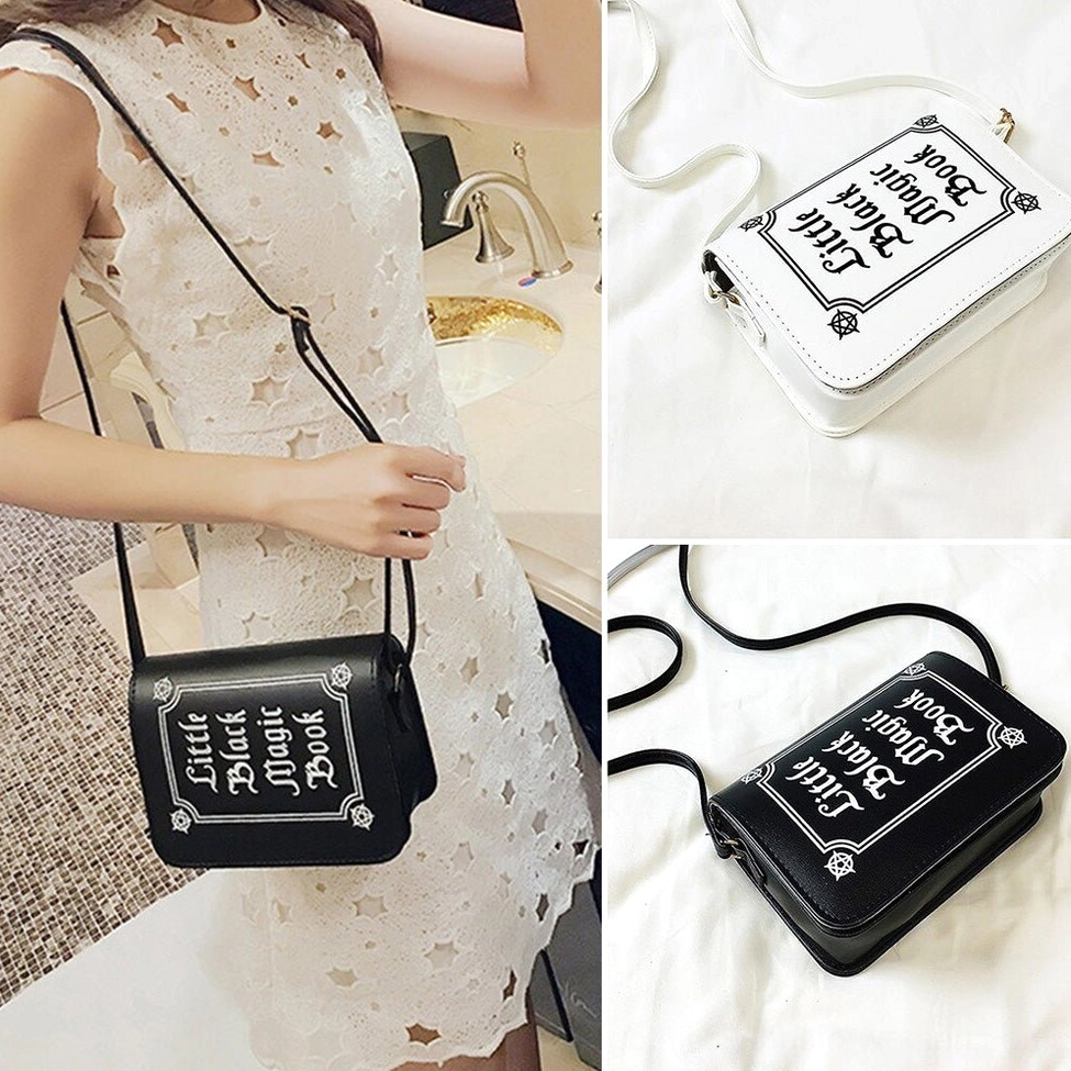 Gothic letter crossbody bag side profile view showing bag structure and hasp closure mechanism