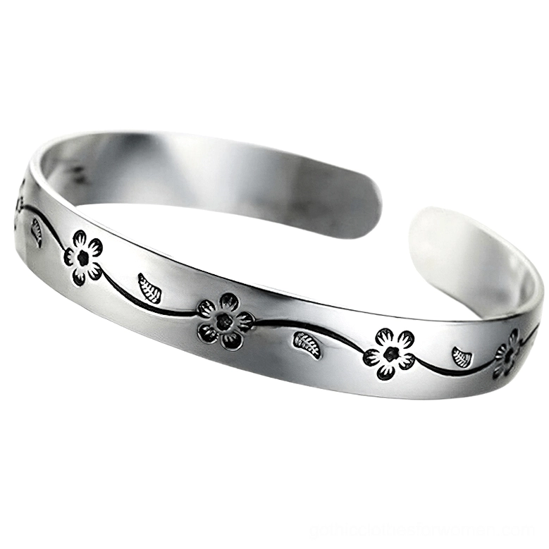 Polished silver bangle with detailed gothic flower engraving, front flat view showcasing the full floral design pattern