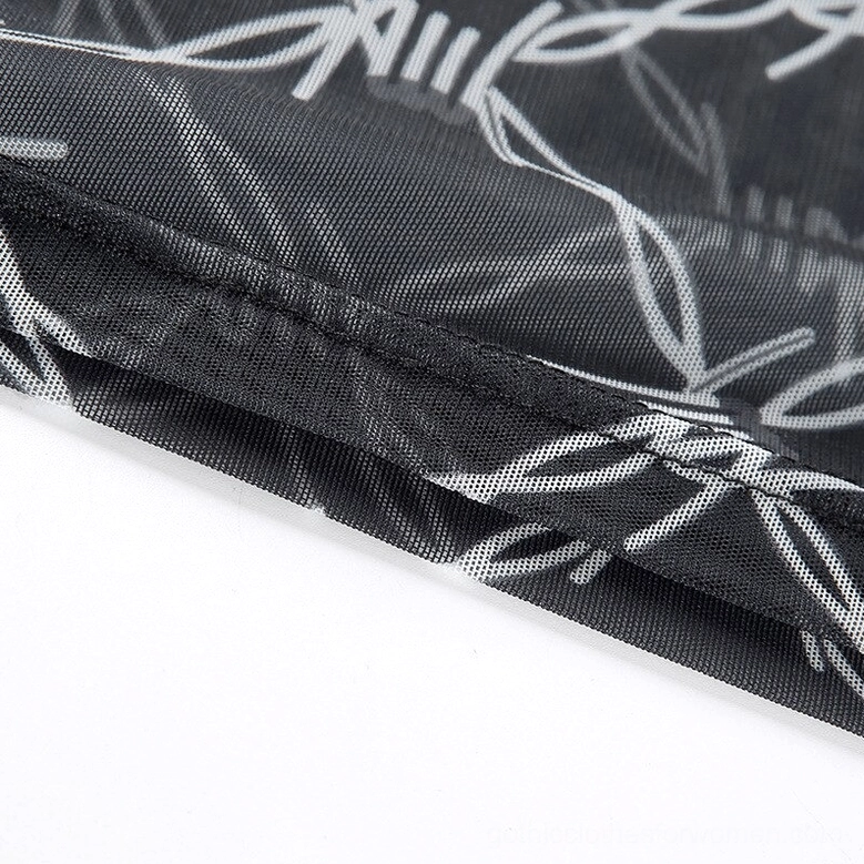 Gothic barbed wire print mesh crop top detail shot showing fabric construction and pattern