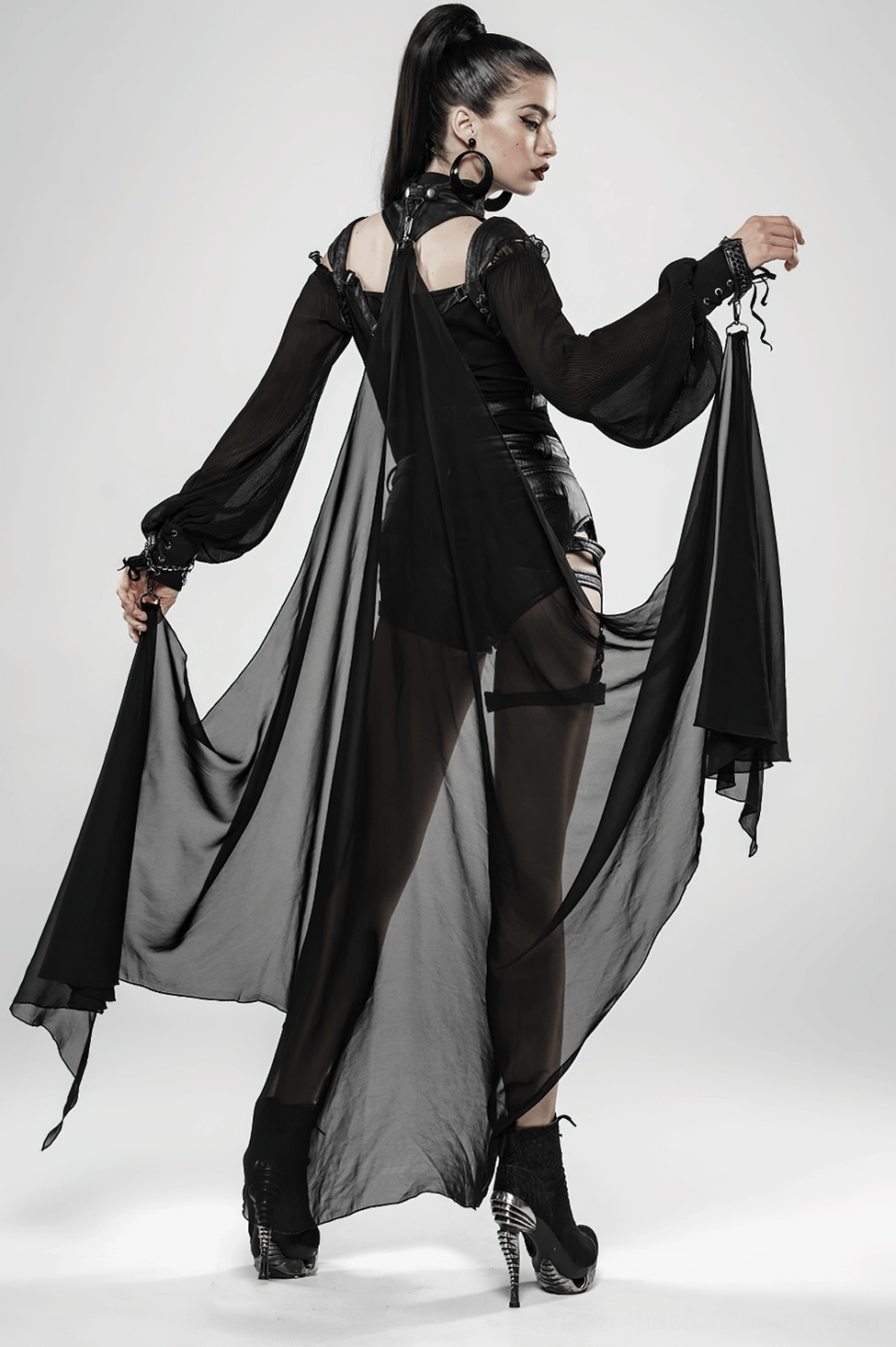 Black batwing cape styled ensemble showcasing gothic fashion aesthetic