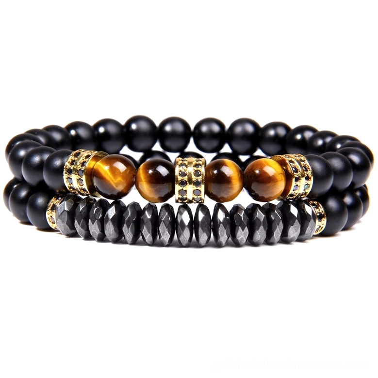 Gothic unisex stone bracelet with black beads, golden yellow tiger eye gemstone, and gold tone metal spacer accents