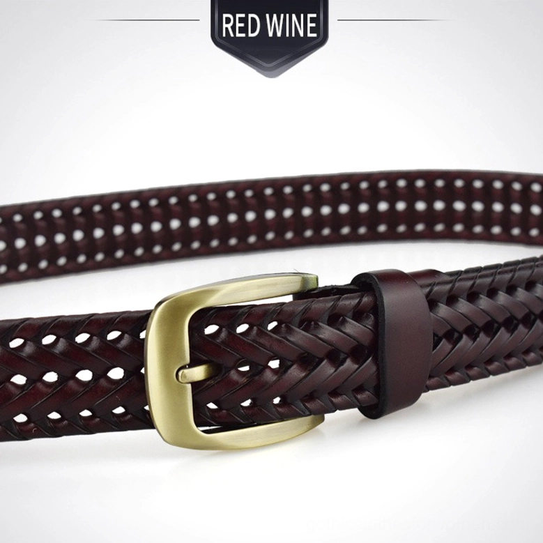 Hand-knitted gothic leather belt detail shot showing close-up of geometric braiding pattern and metal buckle hardware