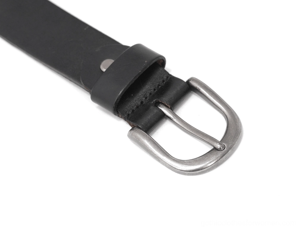 Side close-up shot of leather belt strap, metal buckle, and single rivet fixed connection in black and silver tones