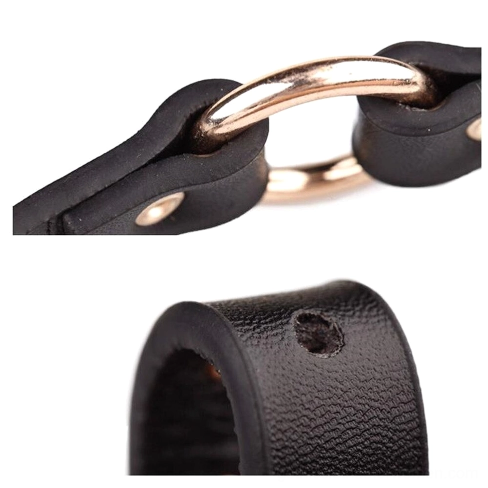 D-ring hardware and leather loop attachment detail, close-up top view of black gothic belt metal hardware
