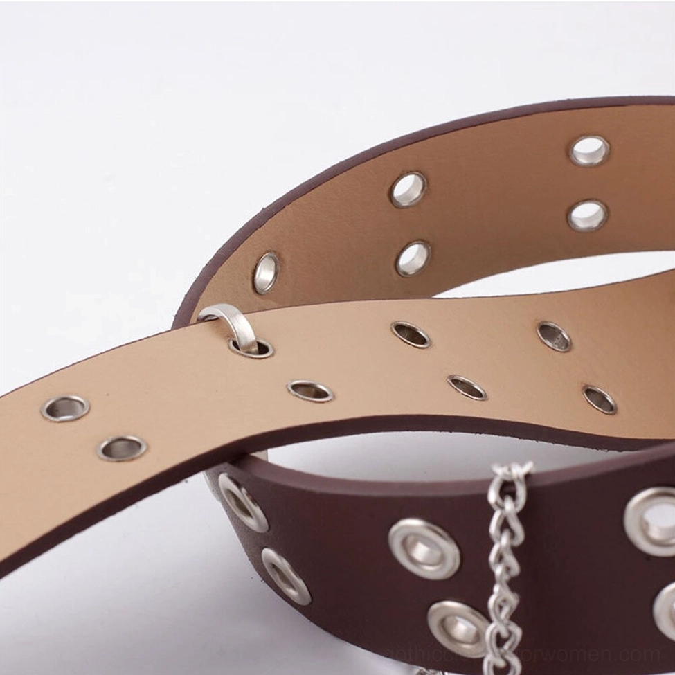 Gothic belt interior lining showing tan leather underside and reinforced metal eyelets with chain accent