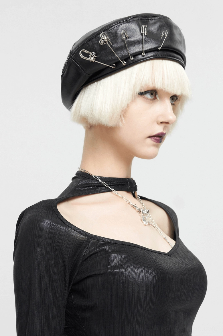 Left side profile of black gothic beret worn by model with blonde hair, paired with gothic neck accessories