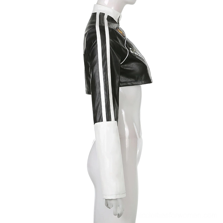 Left side view of black and white patchwork cropped biker jacket on display showing double white sleeve stripes